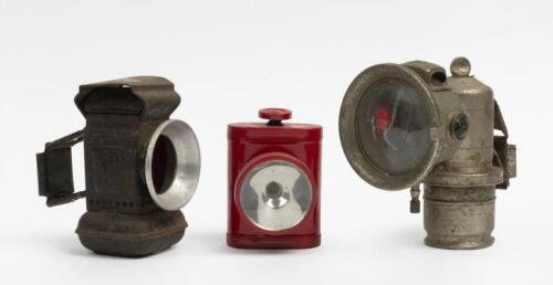 BIKE LAMPS: A collection of three vintage English bike lamps including a Lucas carbide, a wick lamp and one other.