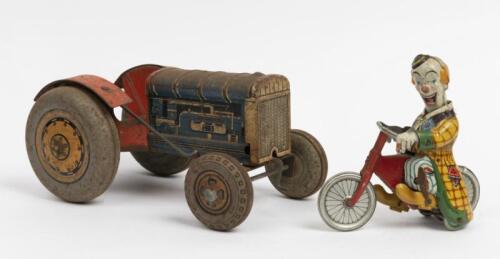 TIN TOYS: Two vintage tin toys including wind up clown on bicycle made in U.S zone Germany by 'Techo Fix' and incomplete tin toy tractor made in Great Britain