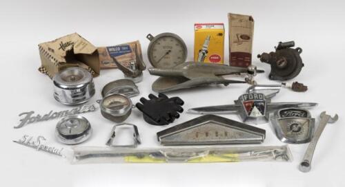 CAR PARTS: A collection of various car parts, predominantly Ford, including badges, gauges and other parts.