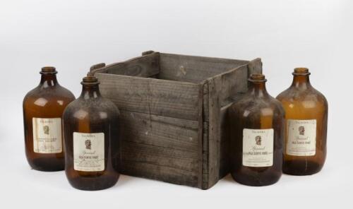 BROWN GLASS: A set of four large 'Talavera' brown glass wine bottles in original crate, 33cm high, 17cm wide'