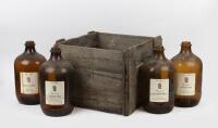 BROWN GLASS: A set of four large 'Talavera'&nbsp;brown glass&nbsp;wine&nbsp;bottles in original crate, 33cm high, 17cm wide'