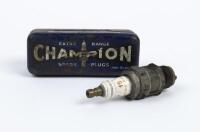 CHAMPION: An 'Extra Range Champion Spark Plug' tin with spark plug.&nbsp;