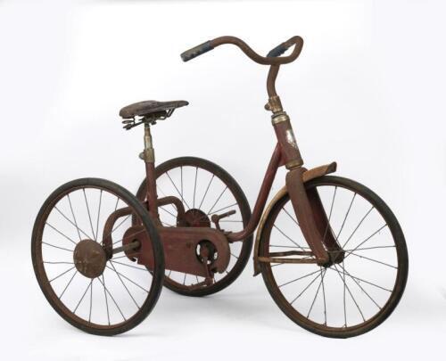 TRICYCLE: A vintage red painted children's tricycle