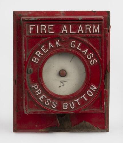 FIRE ALARM: A cast iron fire alarm wall fixture, 20.5cm high, 16cm wide, 7.5cm deep