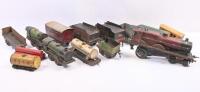MODEL RAILWAY: A collection of three clockwork tinplate locomotives and assorted tenders and wagons.