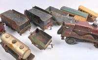 MODEL RAILWAY: A collection of three clockwork tinplate locomotives and assorted tenders and wagons. - 4