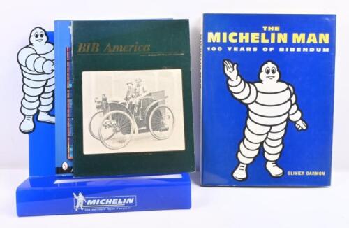 MICHELIN: A collection of three 'Michelin Man' books and a 'Michelin Tyre Centre' design advertising stand.