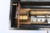 MUSIC BOX: An antique Swiss made music box by 'F Cochon Fabricant&nbsp;Geneva', brass tubular design, box with inlay design to lid. 54cm wide, 14cm high, 22cm deep. - 5