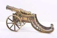 CANNON: A decorative brass cannon on wheels, approx 38cm long. - 3