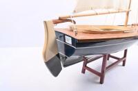 YACHT: A wooden sailing yacht&nbsp;model with fabric sails, complete with stand. approx 80cm long, 98cm tall.&nbsp; - 3