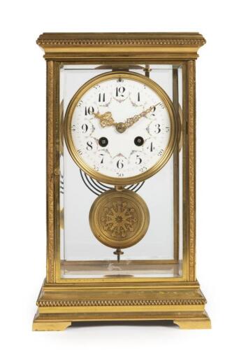 CLOCK: A fine late 19th century French 4-glass bronze mantle clock with enamelled face and 'Japy Freres' movement, with key, 30.5cm high, 18.5cm wide, in working order.