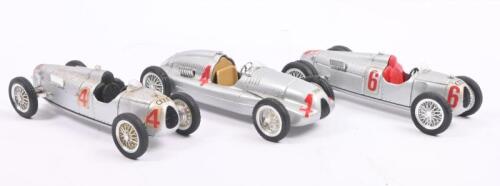 AUTO UNION: Three 'Brumm' 1:43 scale model cars. Two 1936 Auto Union Type 'C' race cars, one with dual rear wheels and one 1938 Auto Union Type 'D' race car.
