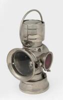 LAMP: An early nickel plated brass Lucas Model 636 oil tail lamp, with ruby glass side lense,&nbsp;&nbsp;26cm high