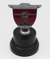 BROOKLANDS: An original Brooklands &lsquo;Flying Club&rsquo; enameled membership grill badge by H.A Shelley & Co and numbered &rsquo;72&rsquo;, on Bakelite base