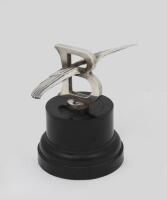 BENTLEY: An large winged 'Flying-B' mascot, as fitted to 4.5, 6, 6.5 & 8 litre W.O. Bentley's of the 1920s/1930s, 21.5cm wide, on Bakelite base