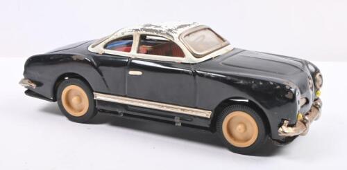 KARMANN GHIA: A circa 1960s Japanese tin toy Volkswagen Karmann Ghia in black with white roof, 24cm long