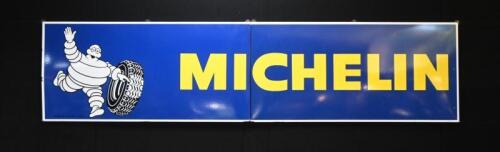 MICHELIN: A large original 1977 two piece Michelin Tyres enamel sign, 294cm wide overall