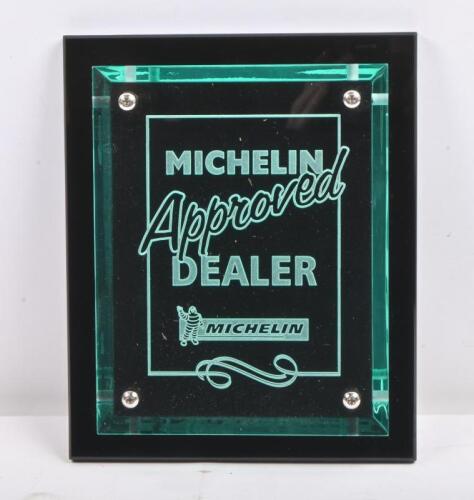 MICHELIN: A Michelin 'Approved Dealer' perspex plaque mounted to backing, 18cm wide, 22.5cm high.