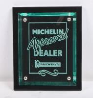 MICHELIN: A Michelin 'Approved Dealer' perspex plaque mounted to backing, 18cm wide, 22.5cm high.