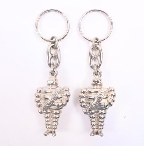 MICHELIN: Two high quality modern Michelin Bibendum metal key chains, approx 4.5cm tall.