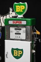 BP: A restored c1960s-1970s Wayne model 605 petrol bowser in BP livery, plastic BP shield logo globe affixed to top. Approx 184cm high - 2