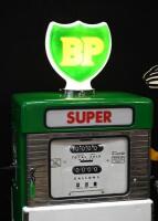 BP: A restored c1960s-1970s Wayne model 605 petrol bowser in BP livery, plastic BP shield logo globe affixed to top. Approx 184cm high - 31