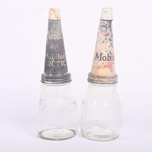 OIL BOTTLES: Two original glass one imperial pint oil bottles with Mobiloil tin tops, each with dust caps.