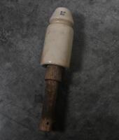 INSULATORS: A large selection of ceramic telephone wire insulators, mostly affixed to wooden posts. - 3