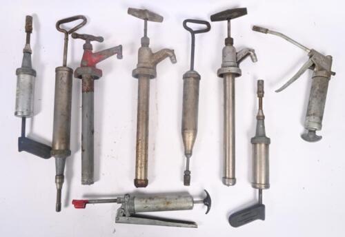 GREASE GUNS: A selection of nine hand held grease guns and oil pumps some with markings/branding including W.H.Sydney,Teclamit, Alemite Stewart Warner and others.
