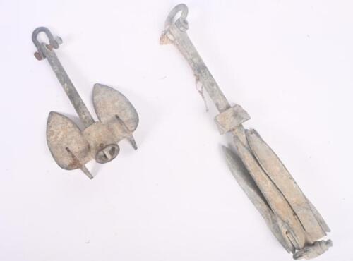 ANCHOR: Two rustic boat anchors, one in grappling hook style.