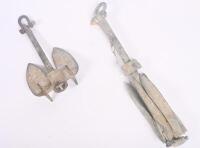ANCHOR: Two rustic boat anchors, one in grappling hook style.&nbsp;