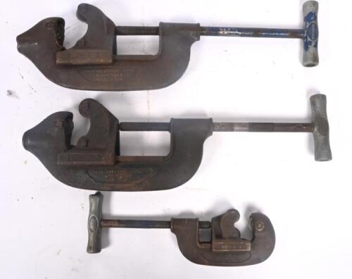PIPE CUTTERS: Three heavy duty pipe cutters by Ridgid includes 2x No.4 and one other.