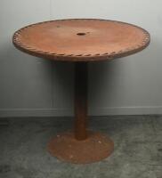 TABLE: A medium sized rustic standing table with saw blade top, mounted to circular base. 78cm tall