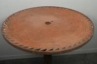 TABLE: A medium sized rustic standing table with saw blade top, mounted to circular base. 78cm tall - 2
