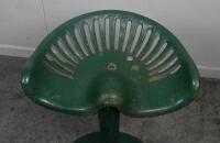 SEAT: A vintage tractor seat mounted to circular cast base, approx 60cm tall, seat unmarked. - 2