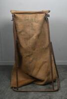 FEED SACK: A vintage metal feed/flour rack holder with hessian bag. Approx 96cm high