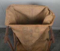 FEED SACK: A vintage metal feed/flour rack holder with hessian bag. Approx 96cm high - 3