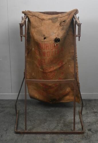 FEED SACK: A vintage metal feed/flour rack holder with hessian bag marked White Rose Flour Mills. Stand Approx 94cm high