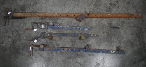 SASH CLAMPS: A collection of four sash clamps, largest measures 195cm high.