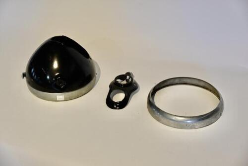 79 · LAMP: A Lucas MU142 8? head light shell, believed to be NOS, with panel nut, no gauge or switch and additional rim [Sydney]