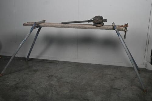 PIPE THREADER: A vintage Pipe Threader with a blue legged work bench and Pipe Vice