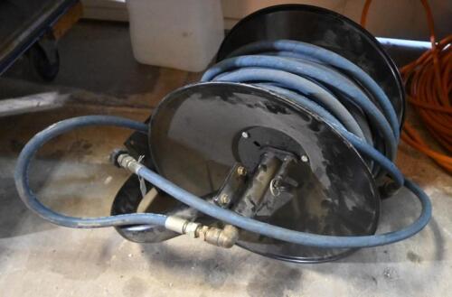 AIR HOSE: A wall mounted hose reel with attached Alfajet 400 high pressure hose 5850PSI