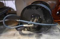 AIR HOSE: A wall mounted hose reel with attached Alfajet 400 high pressure hose 5850PSI - 2