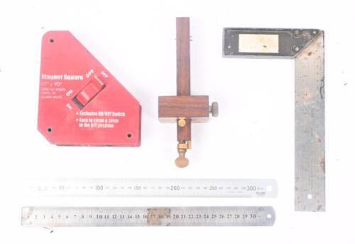 MEASURING TOOLS: A selection of five measuring tools including magnet square and rulers.