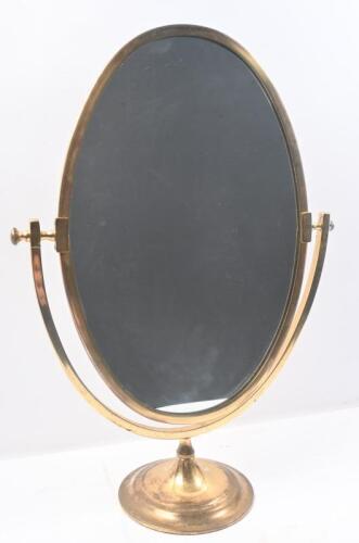 MIRROR: A nice brass framed vanity mirror on round base 58cm high, 40.5cm wide