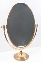 MIRROR: A nice brass framed vanity mirror on round base 58cm high, 40.5cm wide