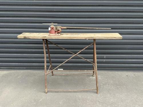 PIPE BENDING: A vintage timber work bench with McPhersons steel bending tool, approx 153cm wide, 60cm deep, 93cm tall.