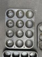 BAKING TRAYS: Three vintage baking trays including tray embossed with shell shape. - 3