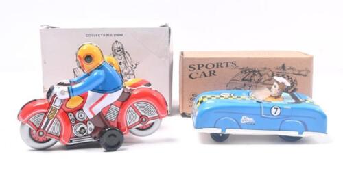 308 · TIN COLLECTIBLES: set of 2 Tin collectible models, 1 1:55 scale Tin Treasures Press N Go blue open racing car #7, with forward motion if driver's head is pushed downwards, and 1 unknown scale multi coloured clockwork motorbike and sidecar, including key, both boxed.