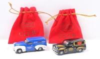 TRAX CLUB:Set of 2 1:55 scale Trax Club Member Special 1953 Holden FJ Panel Vans, 1 Black and Gold 2003, and 1 Blue and White 2004, both in custom red Trax Club velvet pouches.